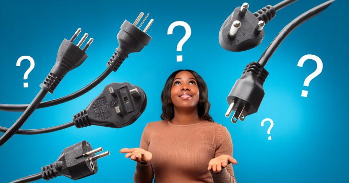 image of a woman looking up at a selection of power cords and question marks, hands up in a questioning pose